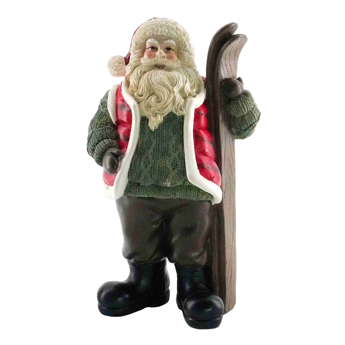 A Santa Claus figurine wearing a green knit sweater, red and white striped jacket, dark pants, and black boots, holding a pair of skis behind his back, isolated on a white background.