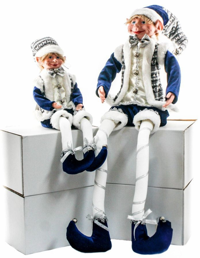 Blue and silver sitting elf figurine with white fur trim, silver bow tie, and navy outfit