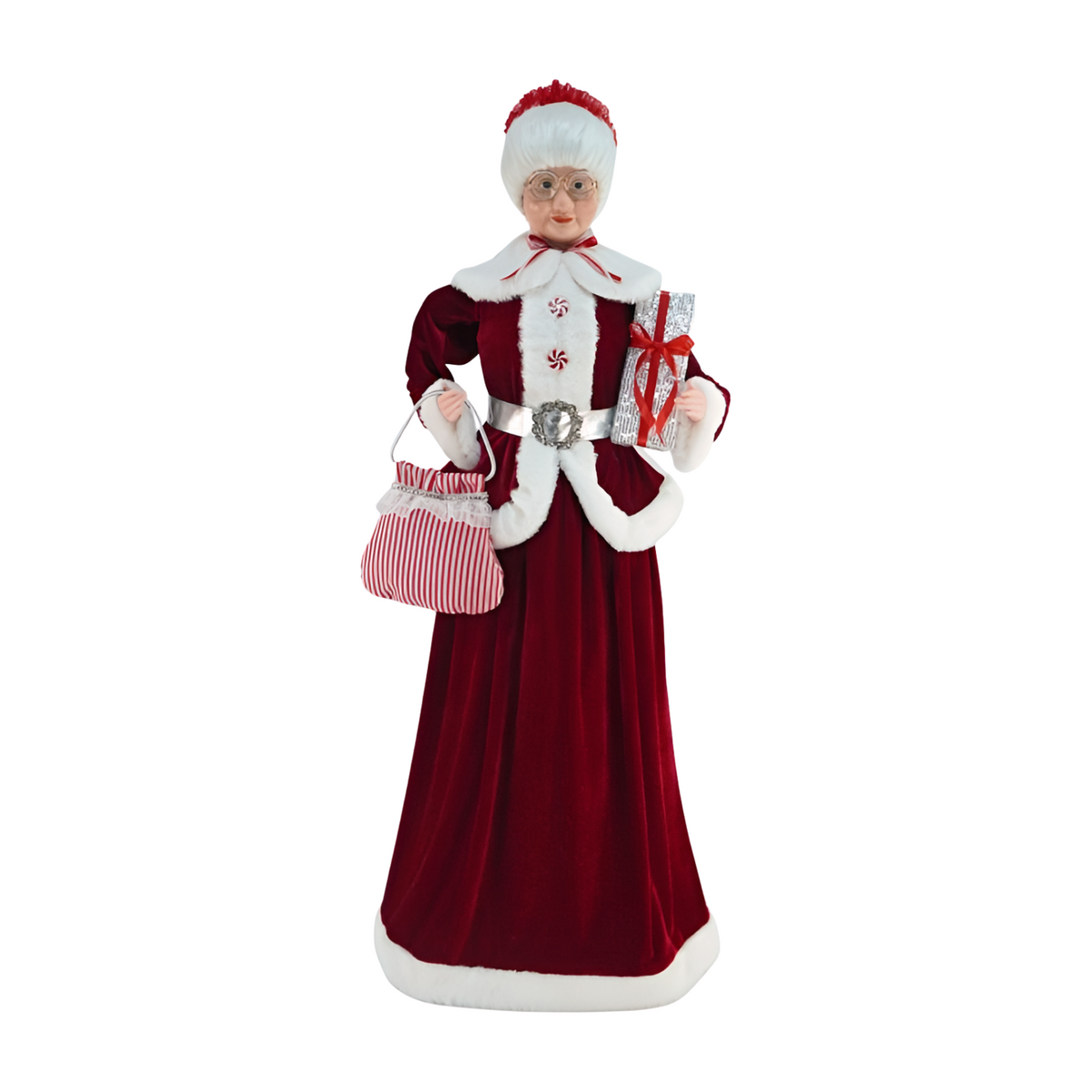 Mrs Claus figurine wearing a red velvet gown with white fur trim, holding a striped bag and a silver gift with a red ribbon