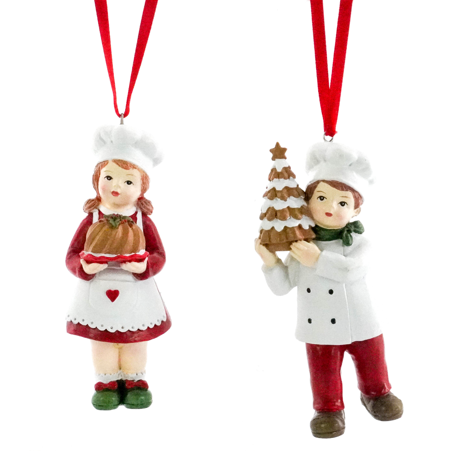 Christmas tree decorations of a boy and girl chef, one holding a gingerbread tree, one holding a Christmas pudding