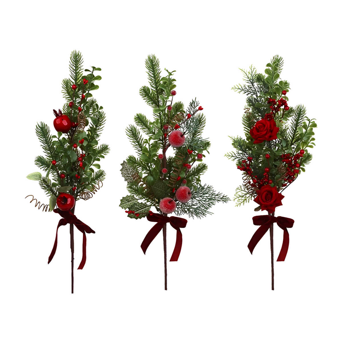 Three Christmas spray picks with pine sprigs, red berries, and velvet bows featuring apples, frosted fruit, and roses