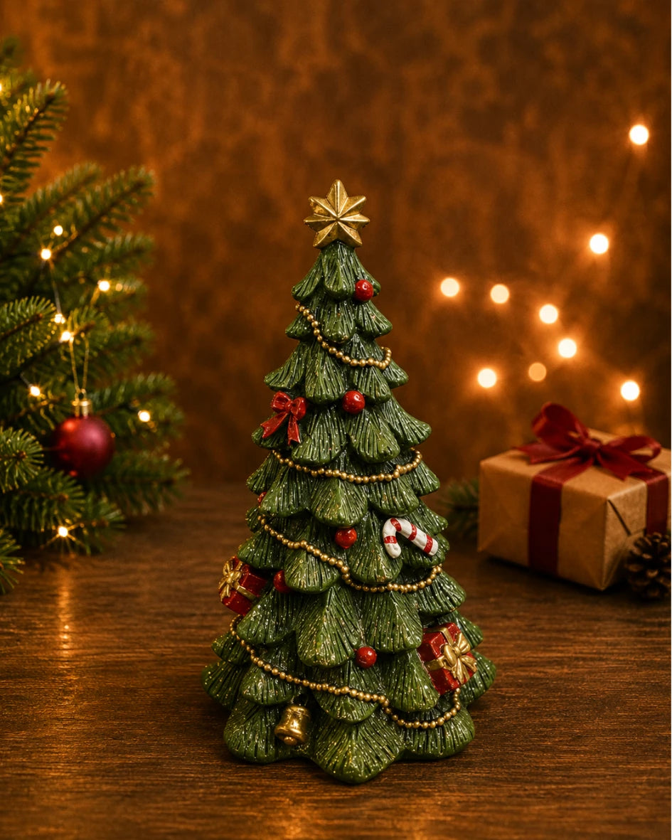 Decorated Christmas tree figure with star topper, styled with pinecone and red berries