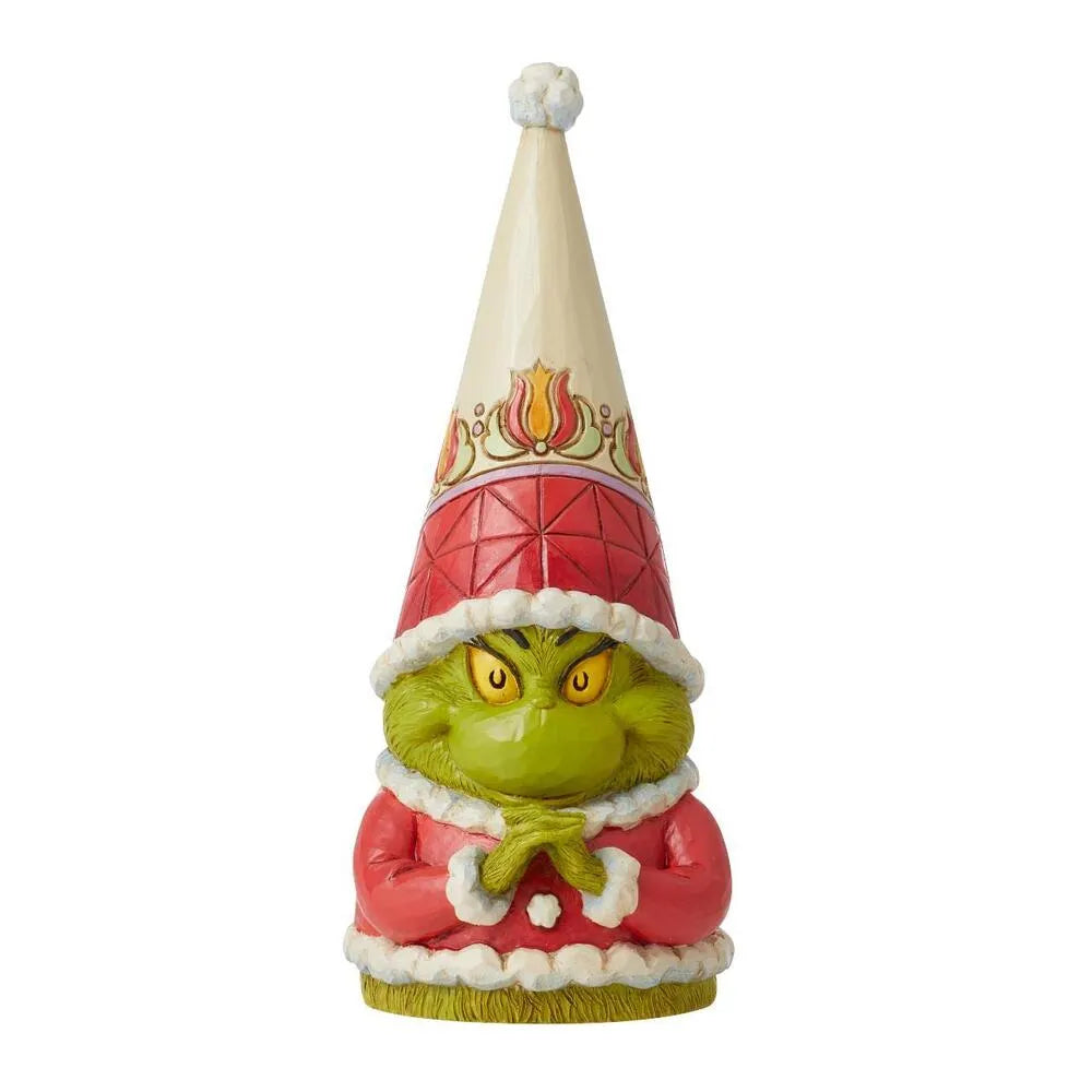 Grinch gnome figurine with a scheming expression, cream cone hat with floral band, red diamond-patterned coat with white trim