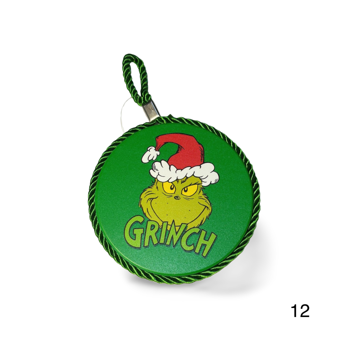 Green round hanging ornament with Grinch design on a white background