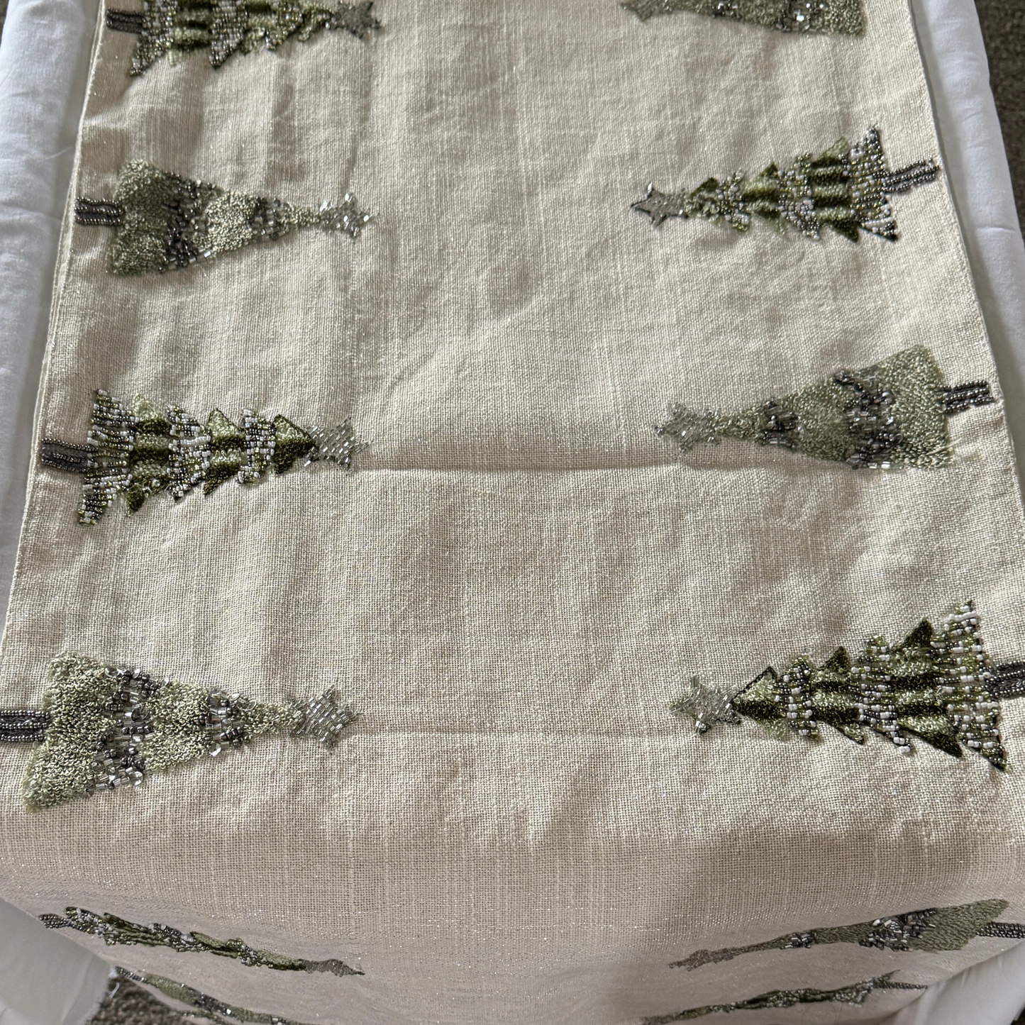 Hand-beaded cream table runner with green and silver Christmas tree design