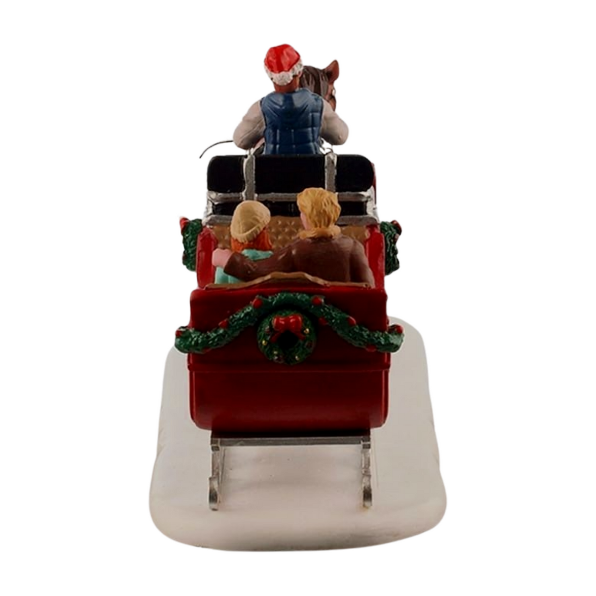 Rear view of Christmas village horse-drawn sleigh figurine with two seated passengers and a holiday wreath on the back of the sleigh