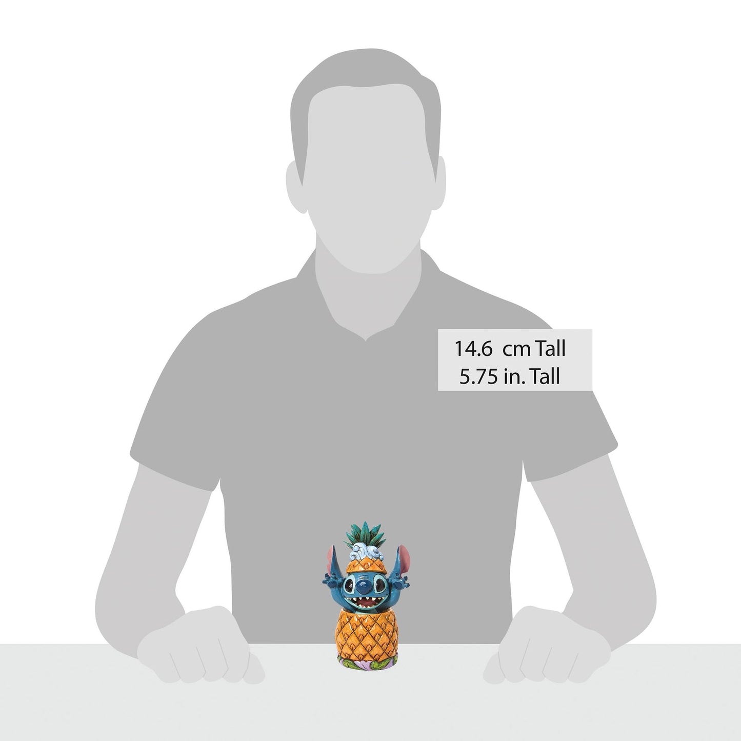 Stitch in pineapple figurine shown against human silhouette for scale, measuring 14.6cm / 5.75in tall