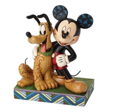Mickey Mouse and Pluto figurine side by side, Pluto seated with scrollwork detailing, on a colourful geometric painted base
