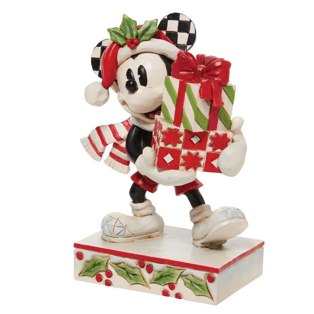 Mickey Mouse Christmas figurine holding gift tower with red bow, wearing checkered ears and scarf