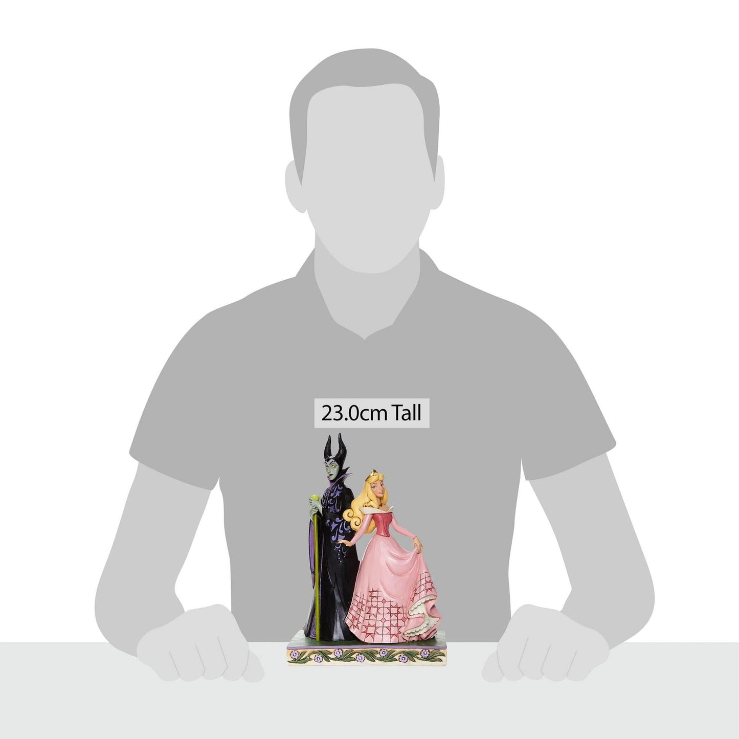 Aurora and Maleficent figurine shown against human silhouette for scale, measuring 23.0cm tall