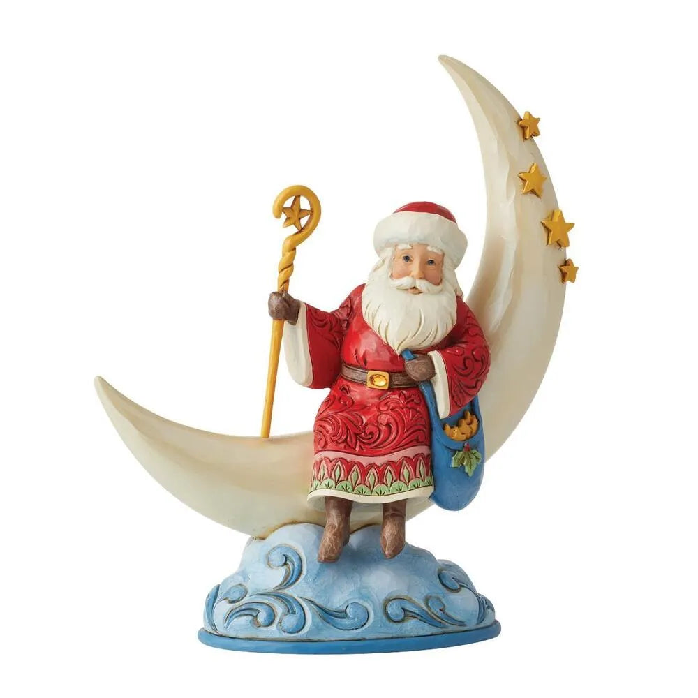 Three-quarter view of Santa figurine on a crescent moon with gold stars, star-topped staff, blue holly bag, cloud base