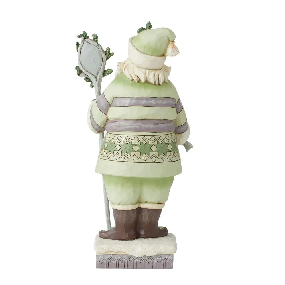 Rear view of Santa figurine in sage green striped coat with Nordic belt, holding a staff topped with a winter scene medallion