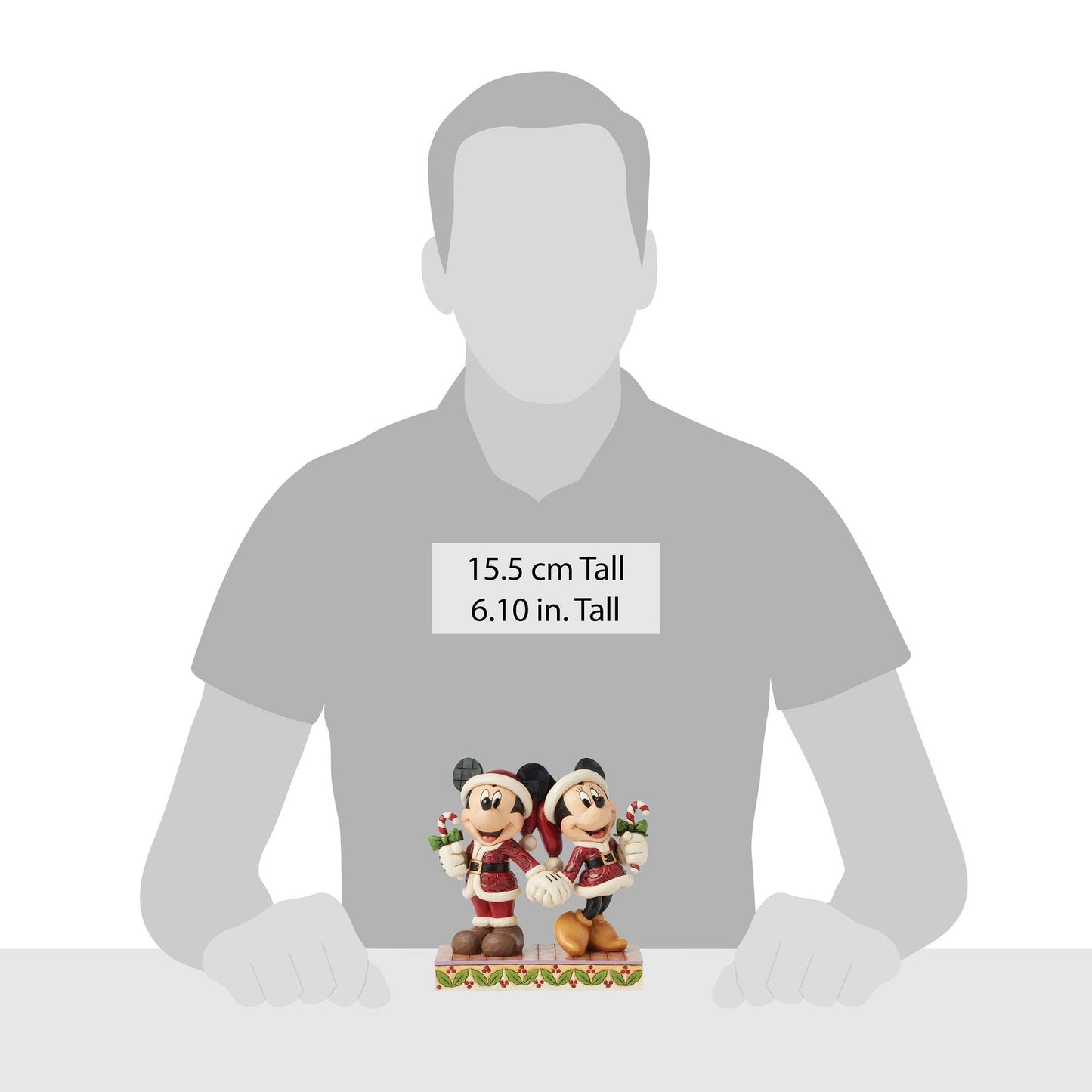 Scale illustration showing Jim Shore Mickey and Minnie Mouse figurine height against an adult silhouette