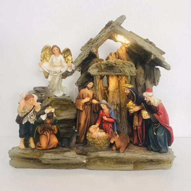 Light-up nativity scene featuring Mary, Joseph, Baby Jesus, the Three Wise Men, a shepherd, and an angel in a rustic stable