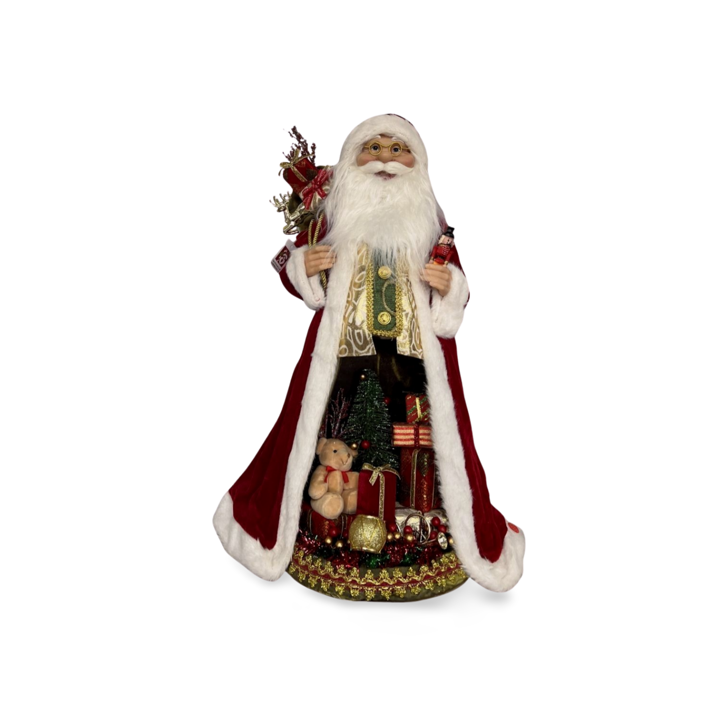 Santa Claus figurine in a red velvet robe with white trim, holding a sack of presents and a nutcracker, with a teddy bear, Christmas tree, and presents underneath his robe