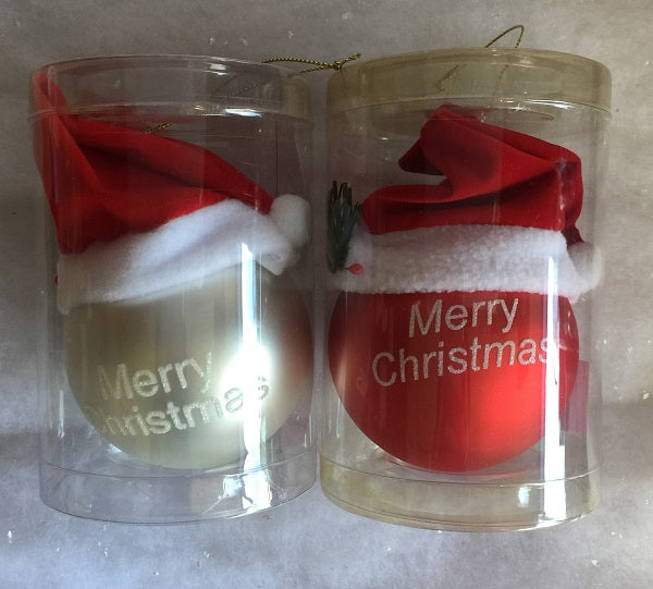 Two Christmas-themed glass tumblers with Santa hats and 'Merry Christmas' text on a faux snow background.