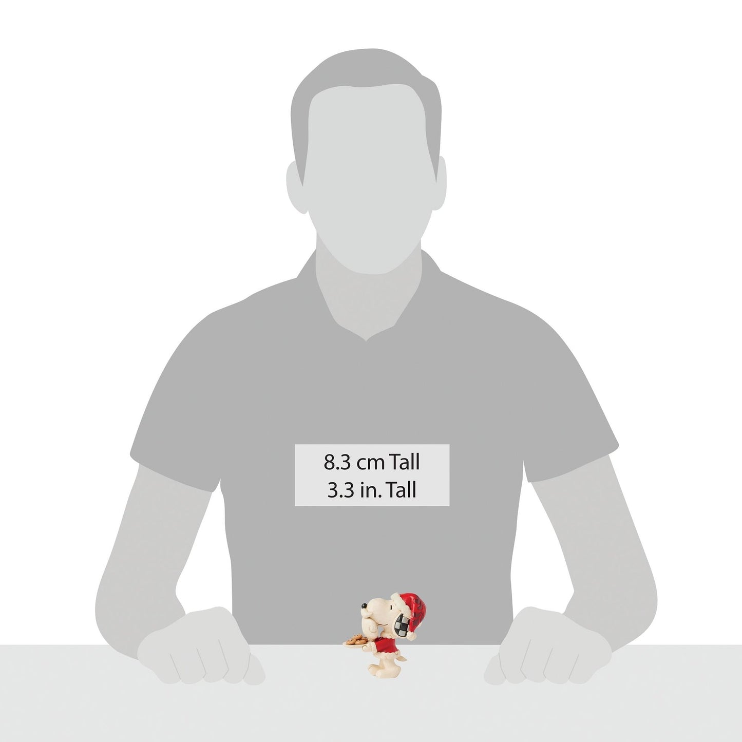 Snoopy Santa figurine shown beside human silhouette for scale, measuring 8.3 cm / 3.3 inches tall
