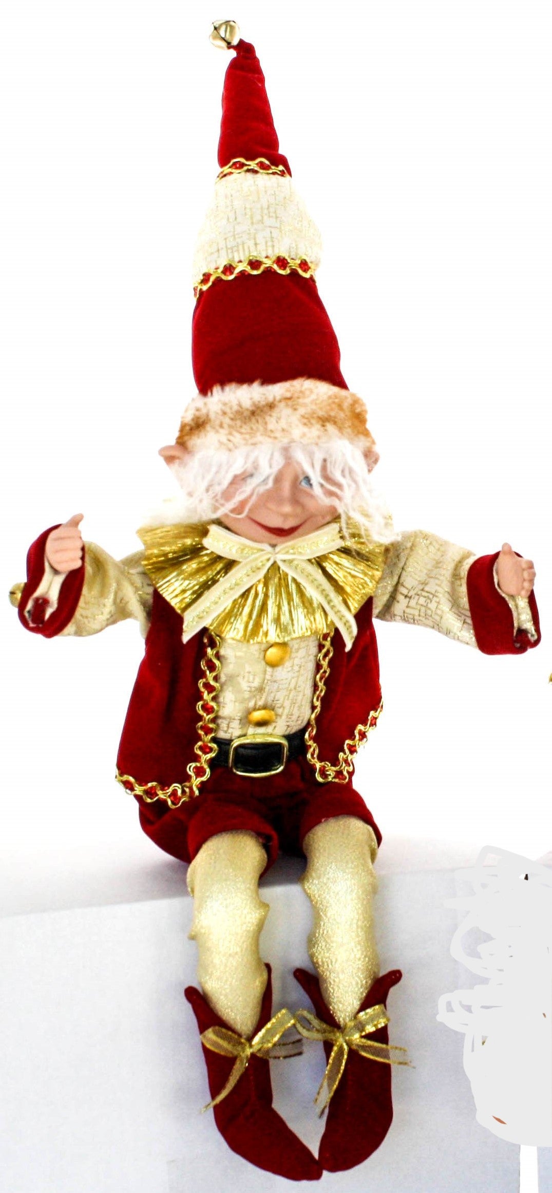 Red and gold Christmas elf decoration with a tall hat, gold collar, and velvet outfit