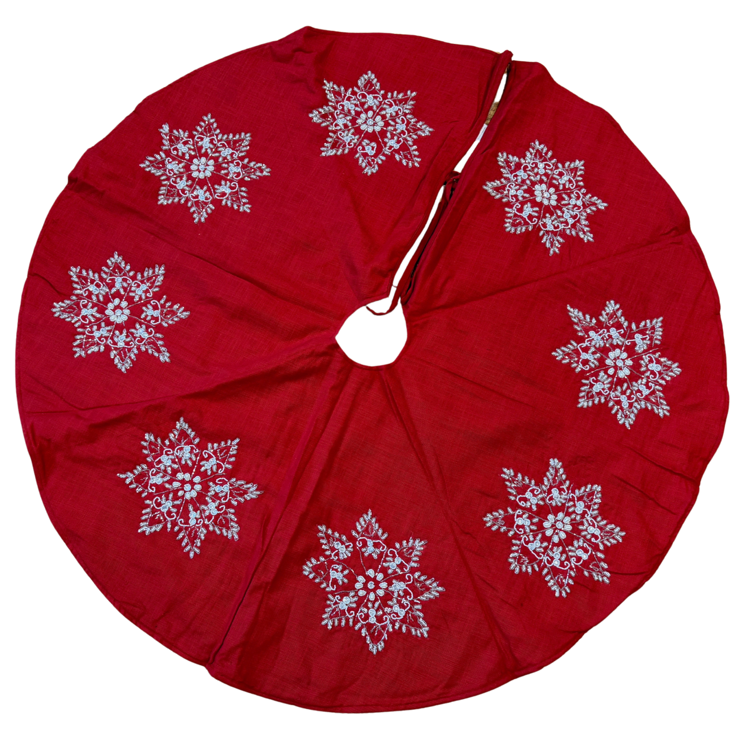 Hand-beaded red cotton Christmas tree skirt with white snowflake designs