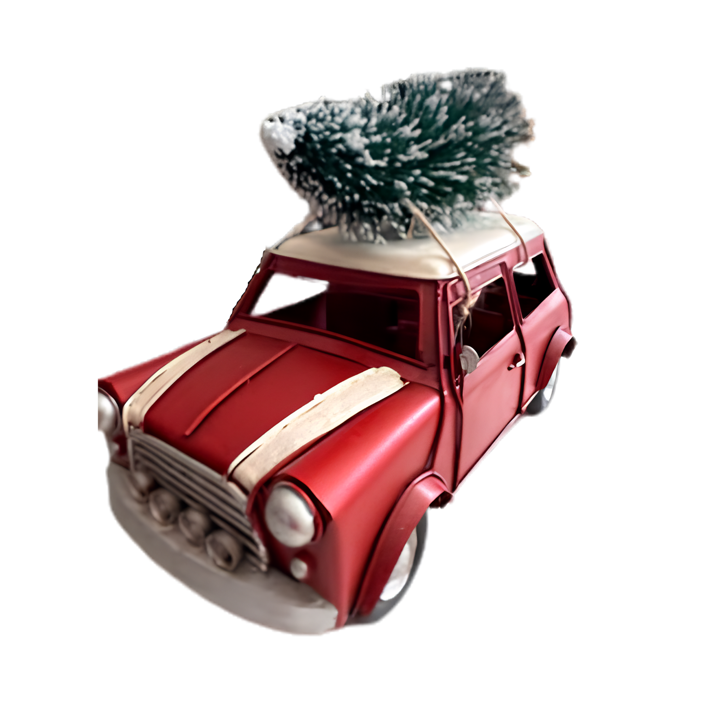 Red vintage mini model car ornament carrying a snow-dusted Christmas tree on the roof