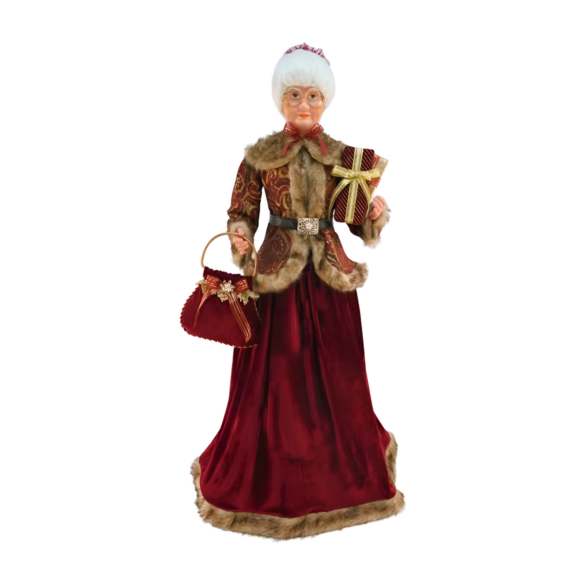 Mrs Claus figurine wearing a red velvet skirt and paisley jacket with fur trim, holding a gift and red handbag