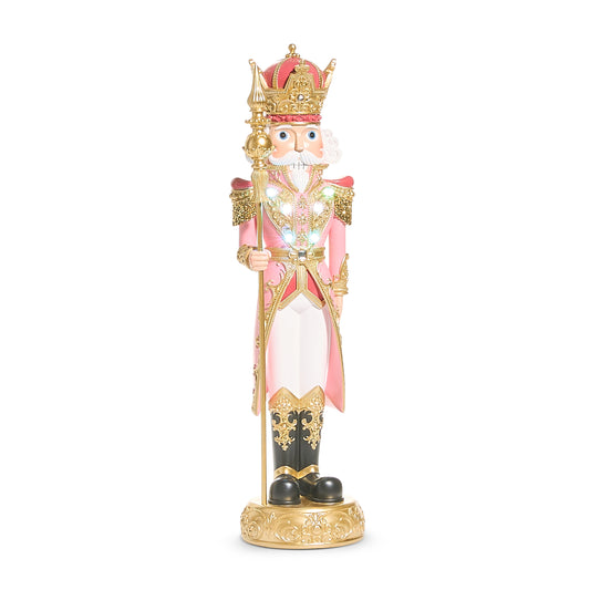 Pink and gold light-up nutcracker decoration with jewelled crown, gold sceptre and multicoloured chest lights