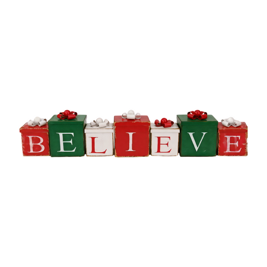 Metal decoration featuring red, green, and white gift boxes with bows spelling the word BELIEVE