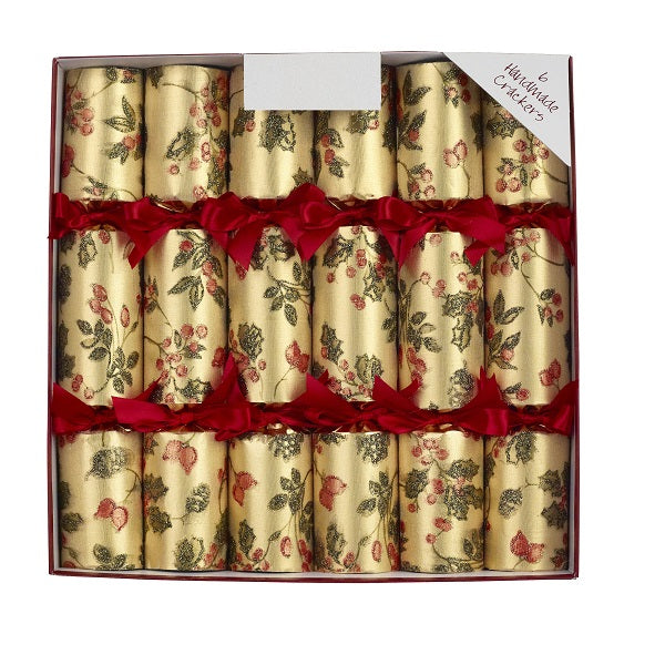 Set of six Christmas crackers with floral design and red ribbons in a box.