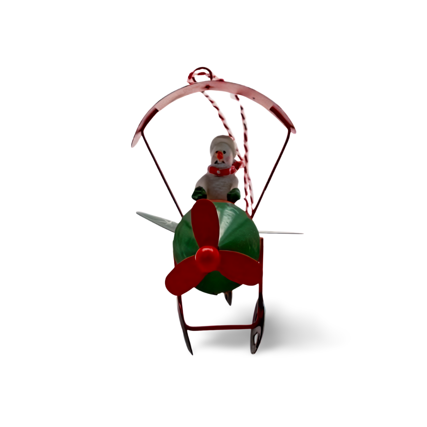 Metal Christmas ornaments shaped like airplanes in red, green, and white, each with a festive character—Santa, snowman, or reindeer—piloting under a striped canopy.