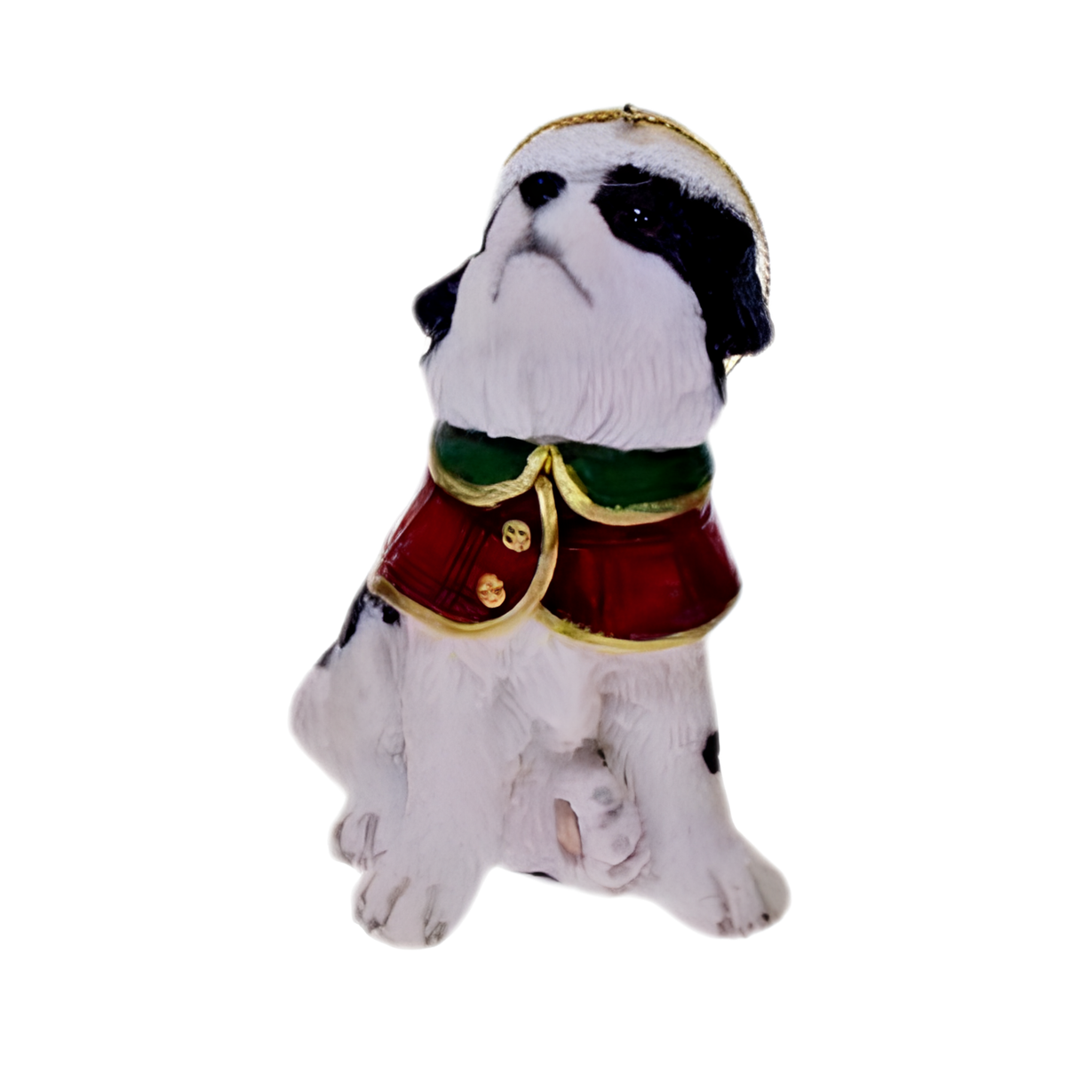Sitting black and white dog ornament wearing a red and green coat with matching winter hat