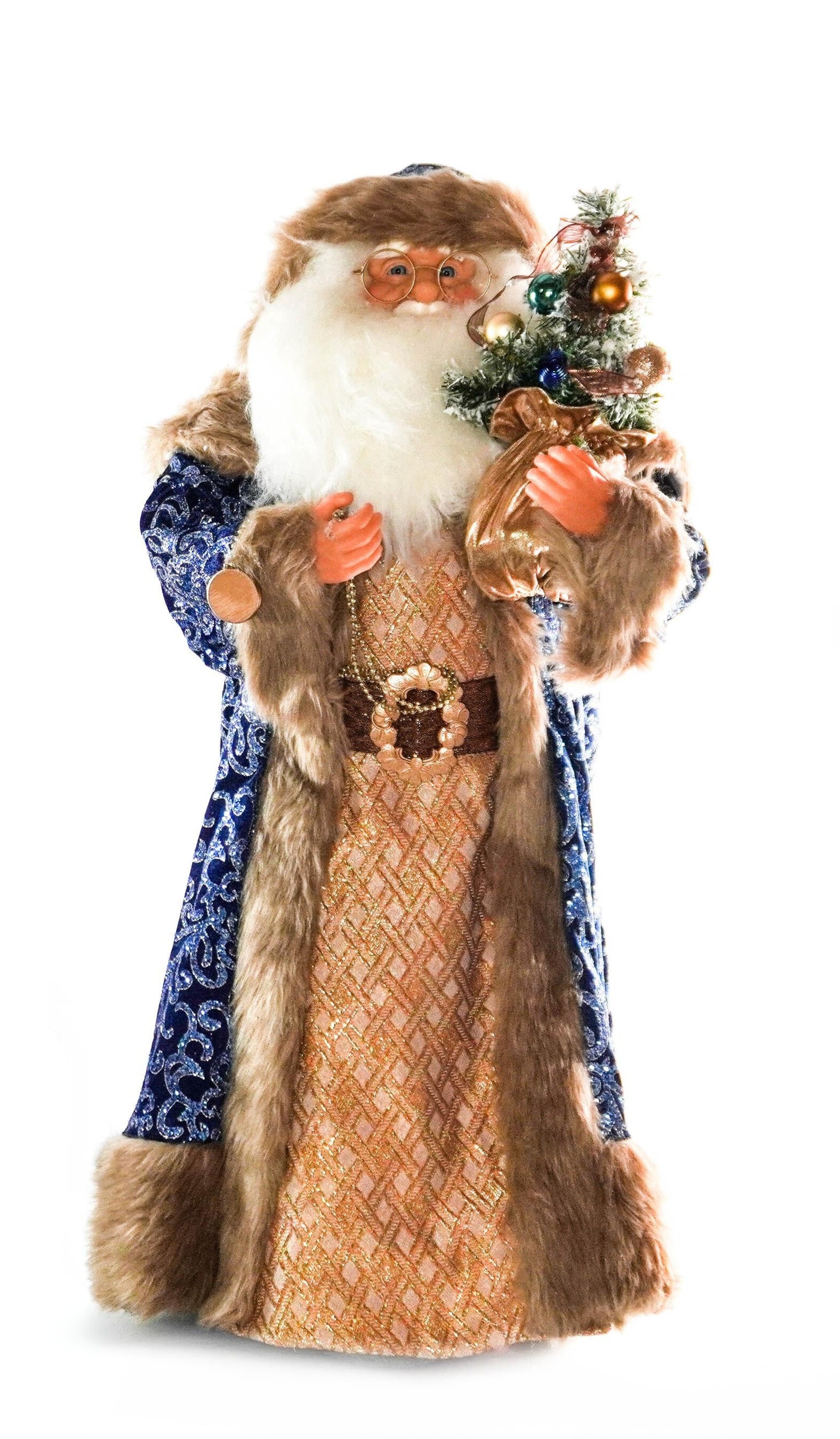 Blue and gold Santa Claus figurine holding a decorated Christmas tree