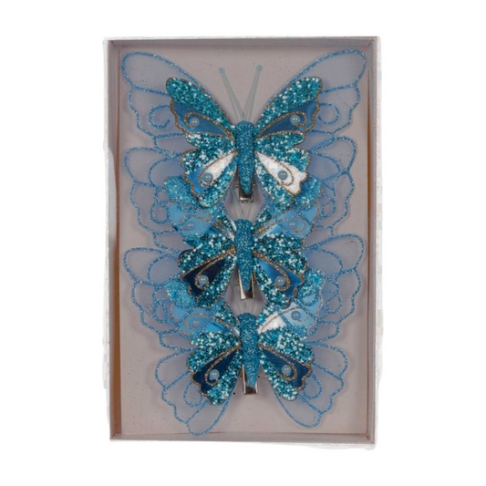 Set of three blue glitter butterfly decorations with mesh wings, sequins, and clip attachments in a gift box
