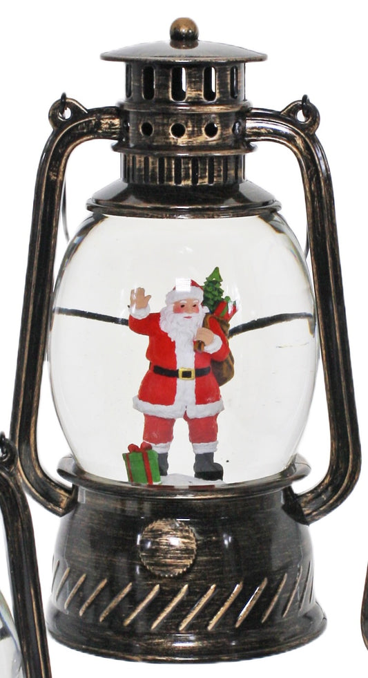 Bronze Christmas lantern snow globe featuring Santa holding a Christmas tree and gifts with swirling glitter.