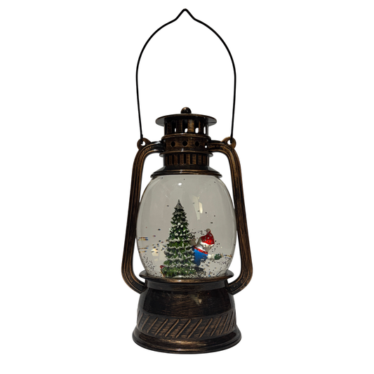 Bronze Christmas lantern snow globe featuring a snowman beside a Christmas tree with swirling glitter.