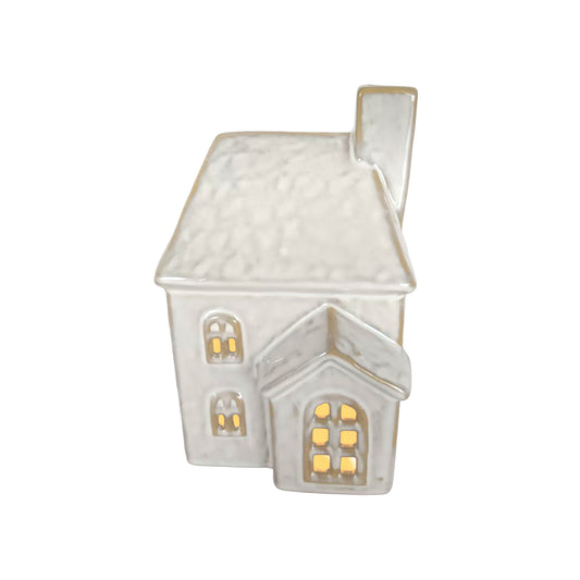 Large ceramic LED house decoration in taupe glaze with textured roof, arched windows, side porch and chimney
