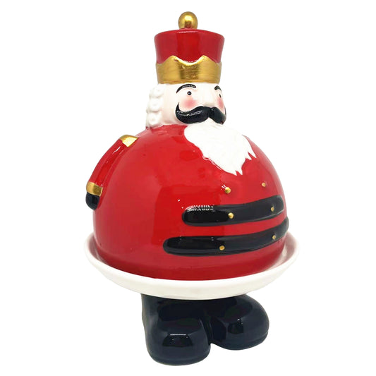 Ceramic nutcracker soldier cloche in glossy red with gold trim, white beard and white plate base