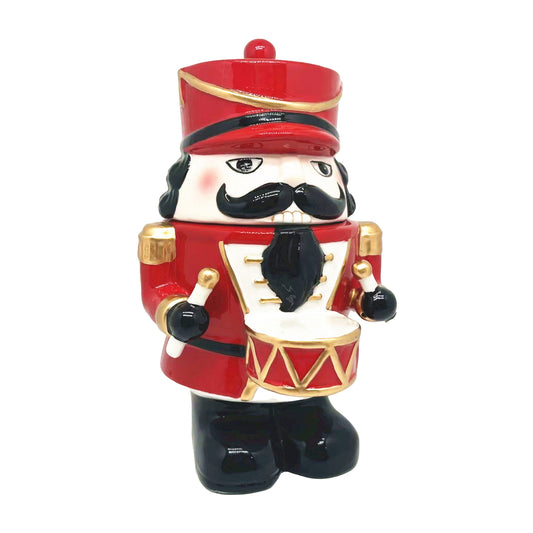 Small ceramic nutcracker soldier jar in red and gold with black moustache, drum and gold epaulette detail