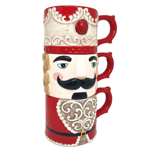 Set of three ceramic nutcracker stacking mugs forming a soldier from hat to body when stacked together