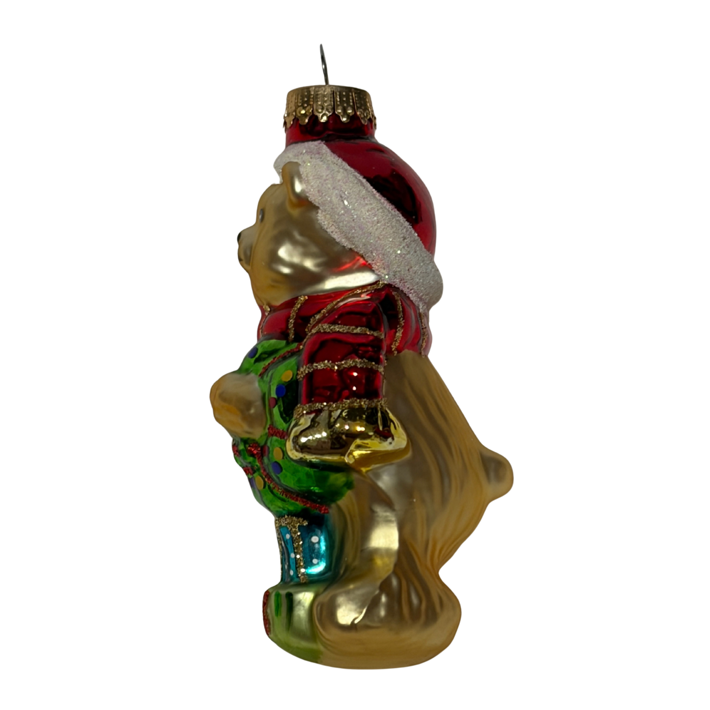 Christmas bear tree decoration wearing a red Santa hat and scarf, holding a green wreath