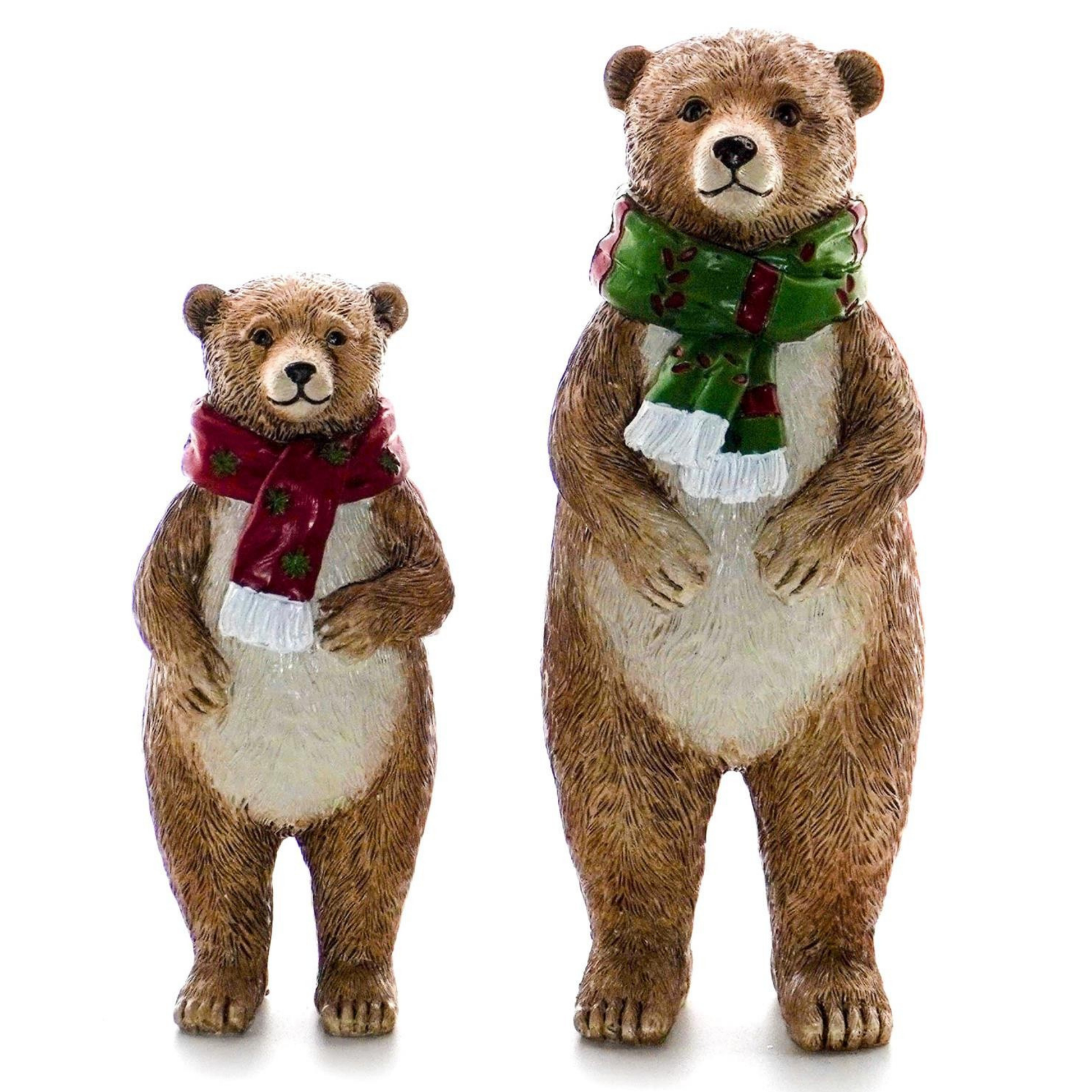 Two standing brown bear figurines wearing Christmas scarves — a smaller one in red and a larger one in green
