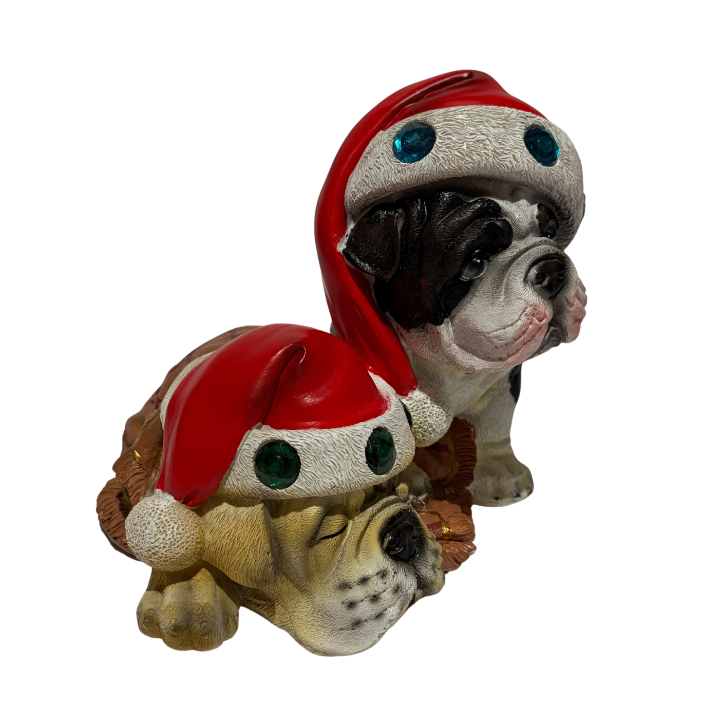 Two bulldogs wearing red Santa hats with colourful jewels, one sitting and one sleeping