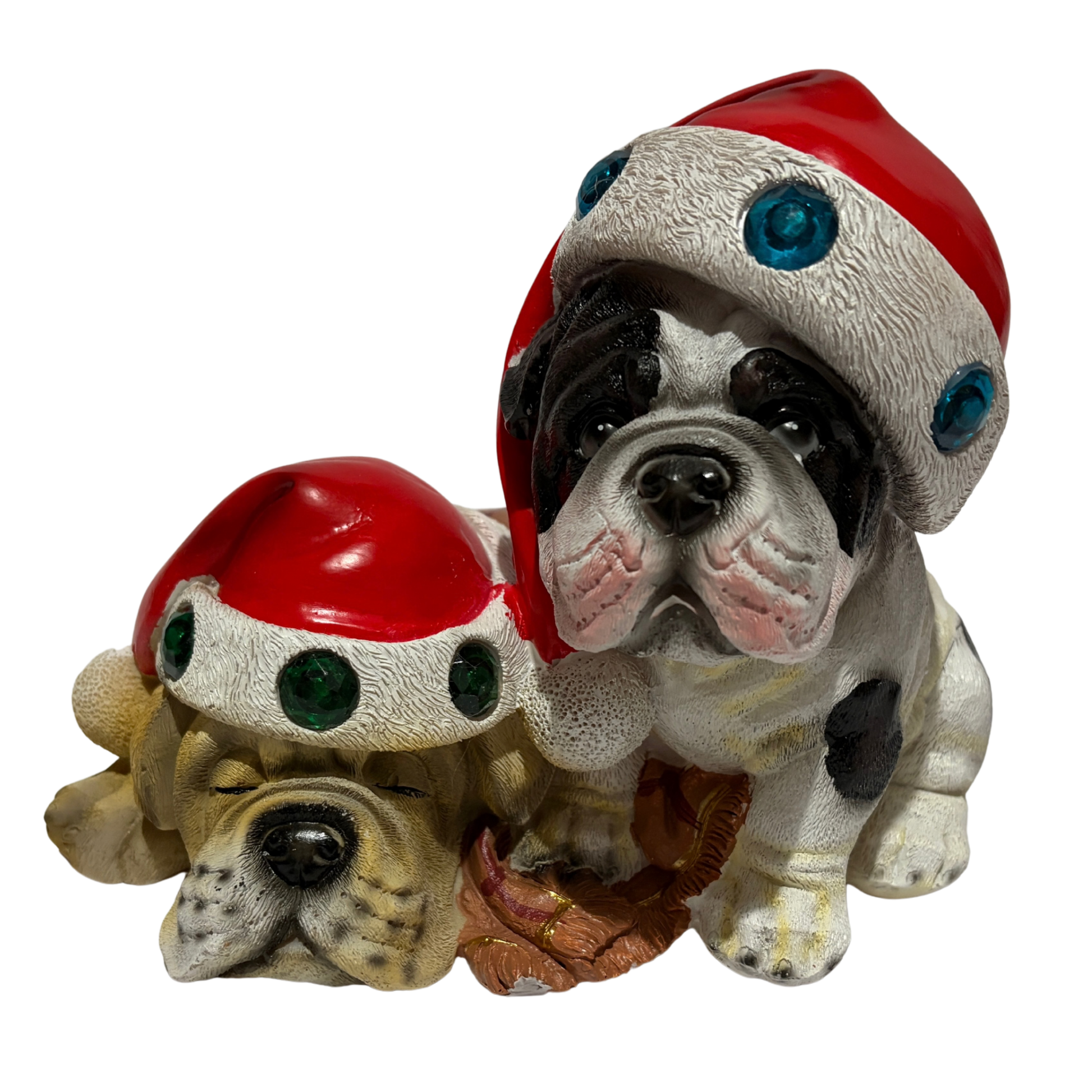 Two bulldogs wearing red Santa hats with colourful jewels, one sitting and one sleeping