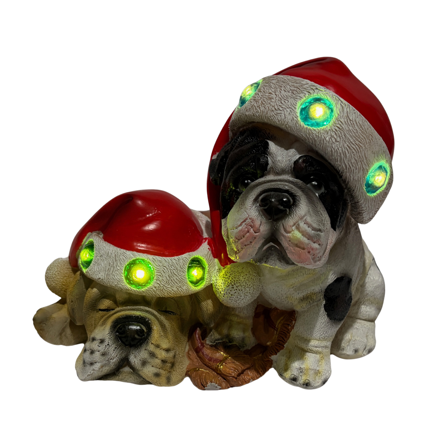 Two bulldogs wearing red Santa hats with colourful jewels, one sitting and one sleeping