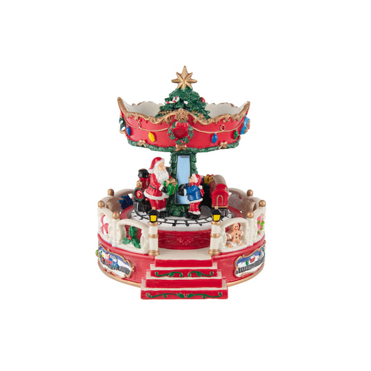 Christmas carousel music box with Santa, child, miniature train, village scene panels and Christmas tree topper