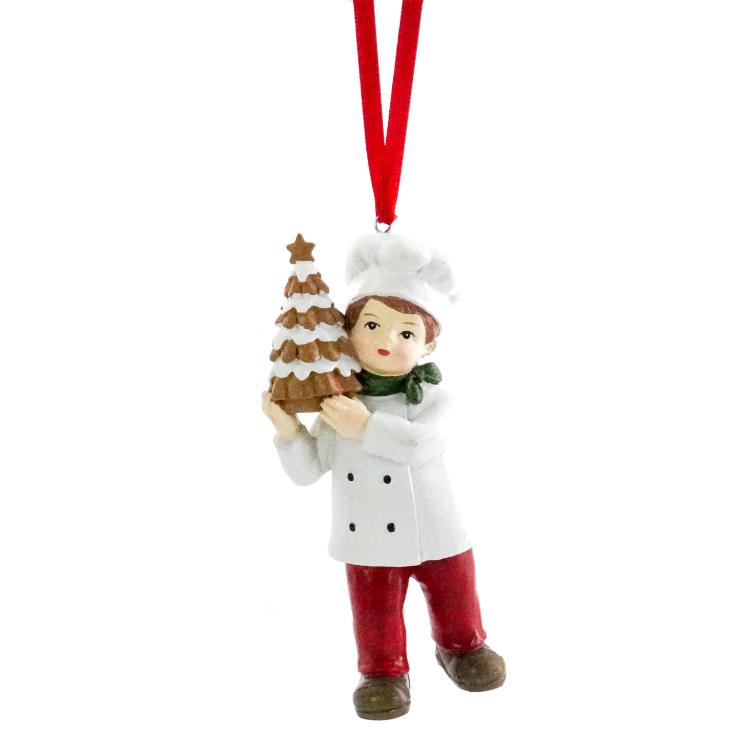 Christmas tree decoration of a boy chef in white jacket holding a tiered gingerbread Christmas tree with a star