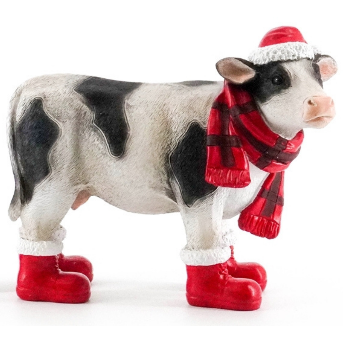 Black and white Christmas cow decoration wearing red Santa boots, tartan scarf and Santa hat