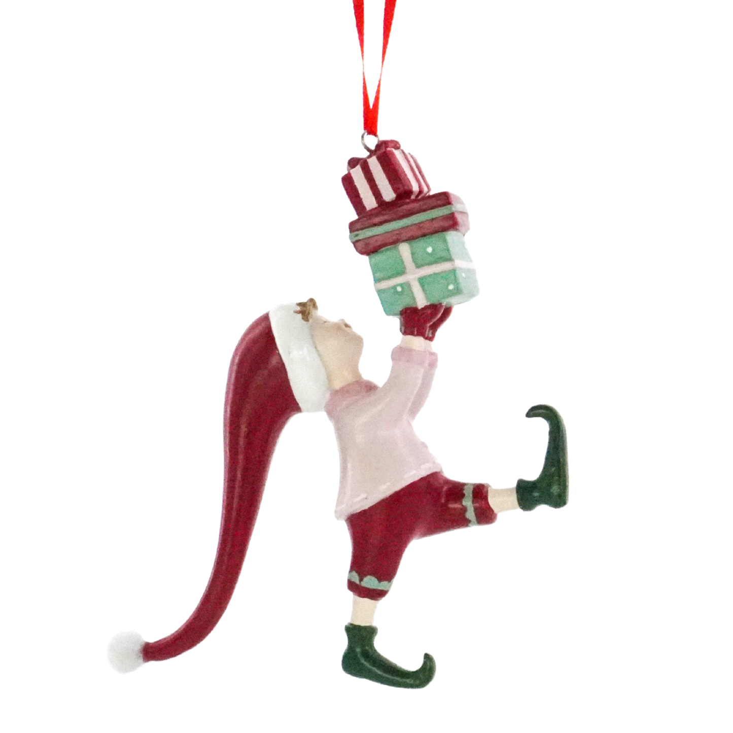 Christmas elf tree decoration balancing a stack of green gift boxes, wearing a long red hat and curled elf shoes