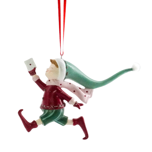 Christmas elf tree decoration running with a letter, wearing a red jacket and long flowing green hat