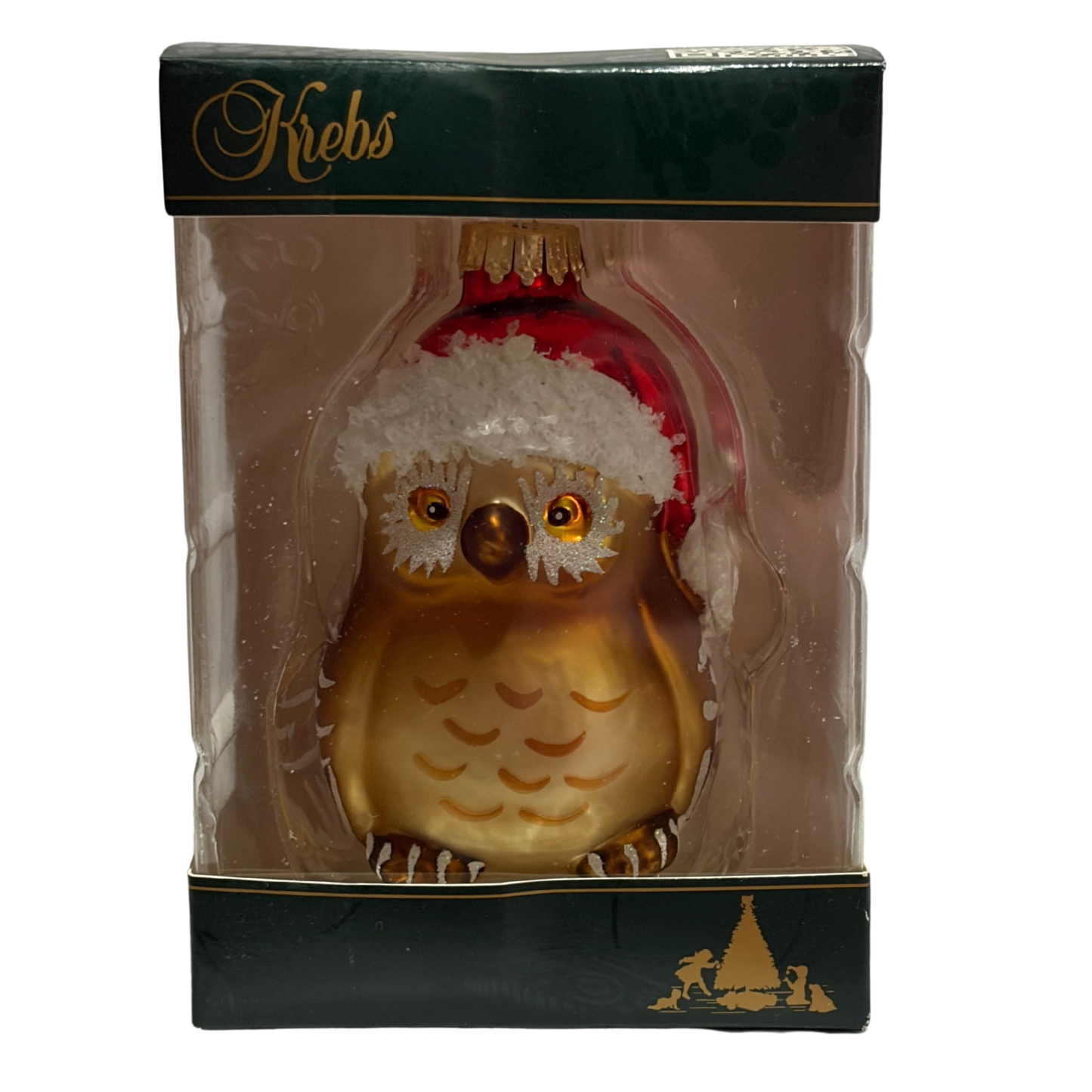 Decorative owl ornament with red hat in clear packaging, brand 'Krebs' visible.