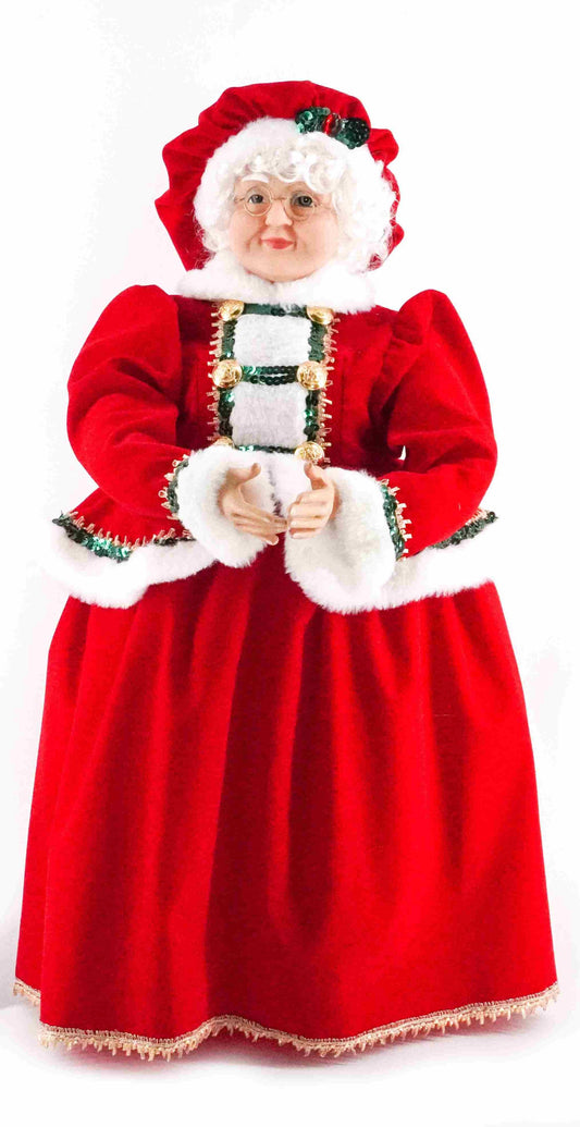 Classic Mrs Claus figurine wearing a red velvet dress with white faux fur trim and green ribbon accents